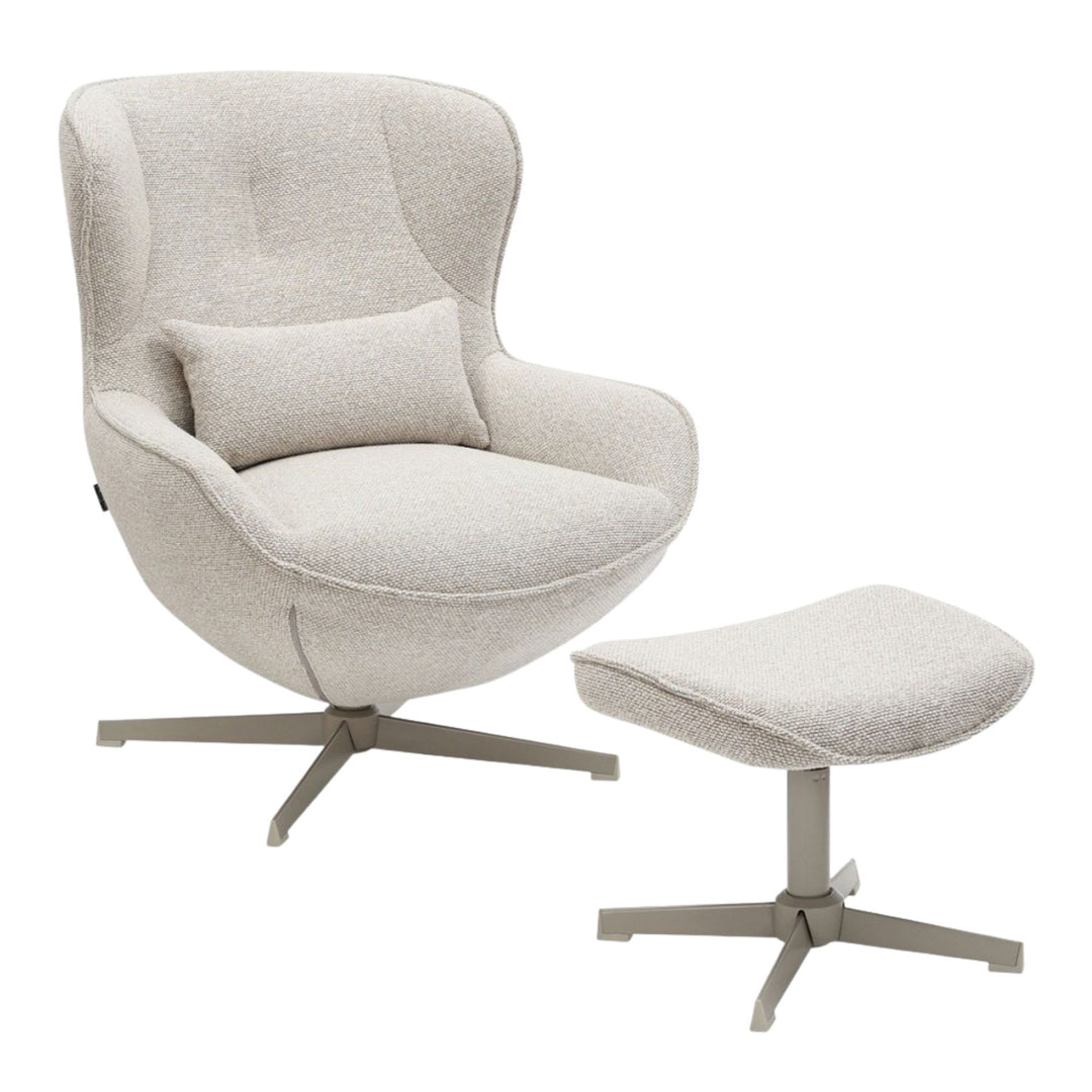 Front view of the Nuba Lounge Chair with matching footstool in cream fabric and metal base.