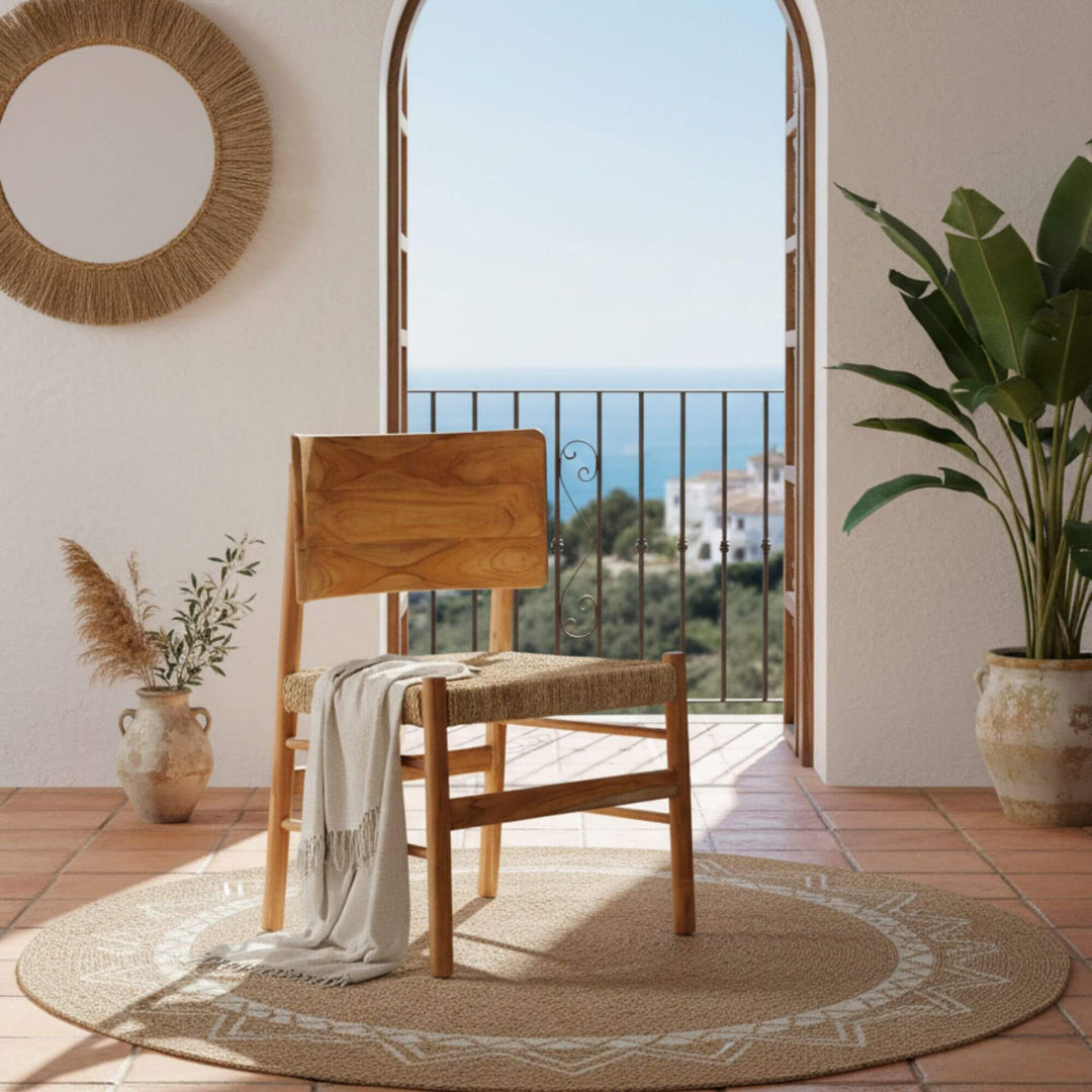 Livinf room setting of Nuva dining chair in natural teak with seagrass seat.