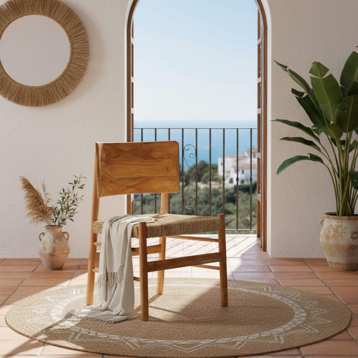 Livinf room setting of Nuva dining chair in natural teak with seagrass seat.