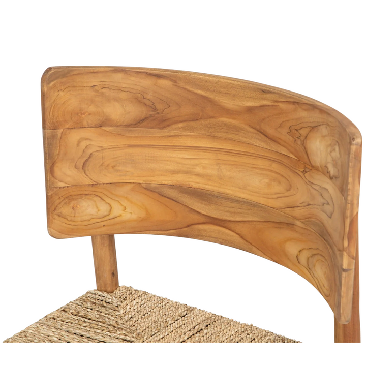 Close-up of curved teak backrest grain detail.