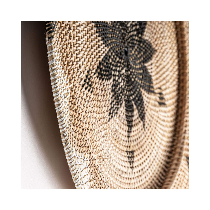 Close-up of Nyis Collection Plate F showing detailed rattan weave and natural fiber texture.