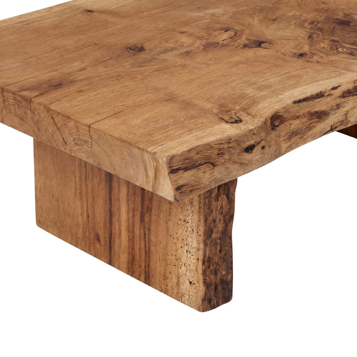 Close-up detail of the tabletop edge showing the natural oak grain and live-edge character.