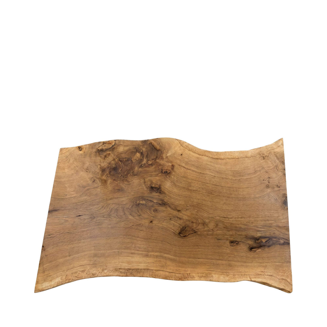 Top view of the table showing its softly irregular shape and rich natural wood variation.