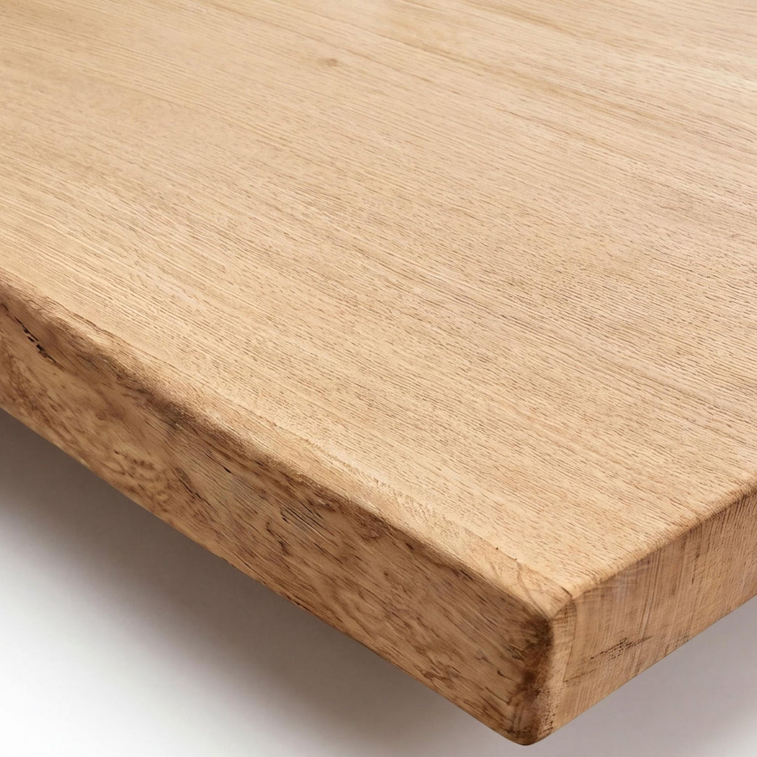 Close-up detail of the tabletop edge showing the natural oak grain and handcrafted finish.