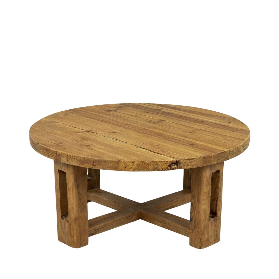 Front view of the Oak Sila round coffee table highlighting its cross-leg base and thick tabletop.