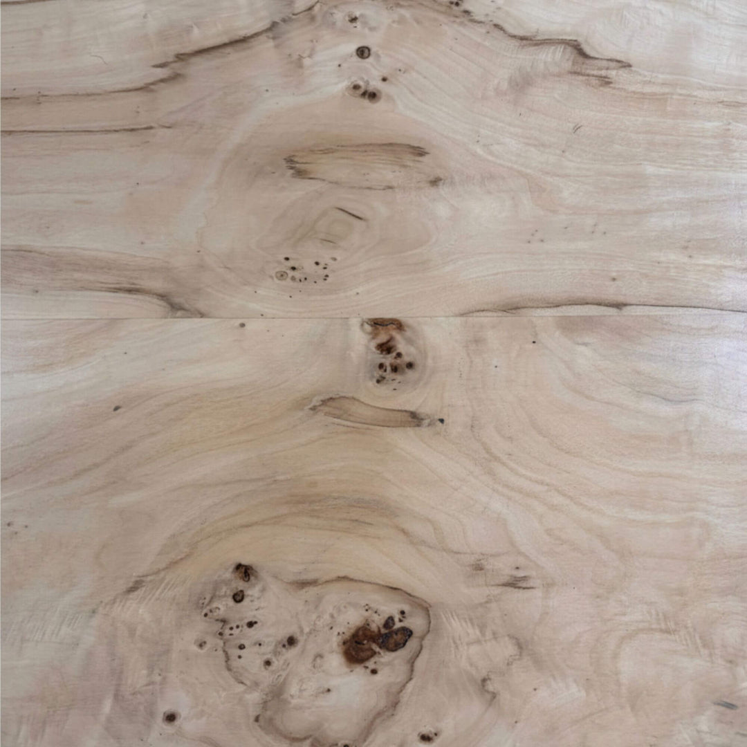 Detailed shot of the wood pattern and organic texture of the dining tabletop.