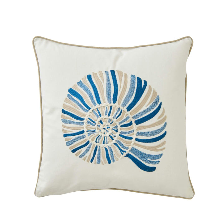 Front view of the Ocean Shell cushion showing its embroidered shell motif in blue and natural tones.