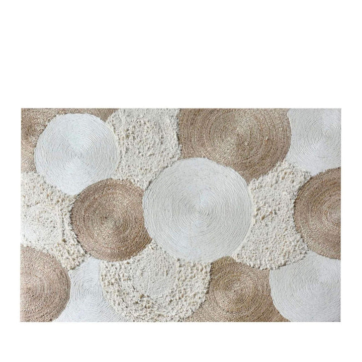 Front view of the Odisha Rug featuring circular woven patterns in natural jute and wool tones.