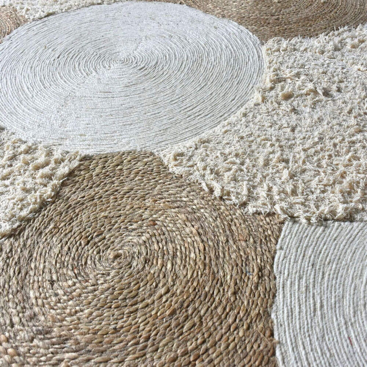 Close-up detail of the rug’s circular weave highlighting natural fiber craftsmanship.