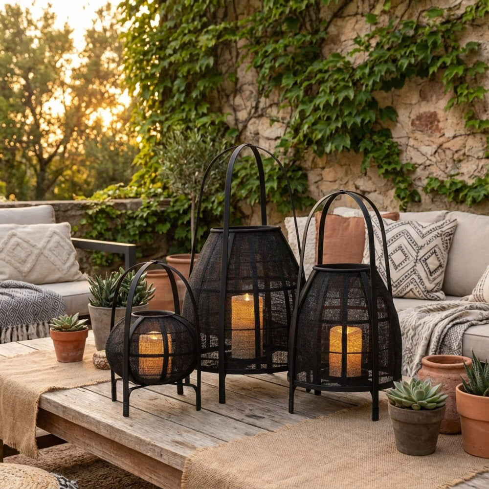 Styled outdoor setting featuring Ogun lanterns creating a warm and atmospheric glow.