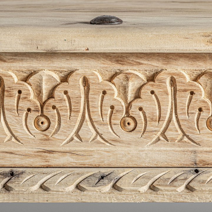 Close-up of the carved floral motifs and antique-style craftsmanship.
