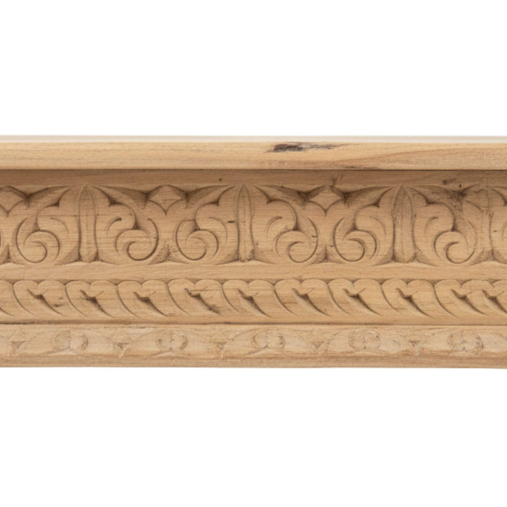 Close-up of the table’s carved edges and antique detailing.