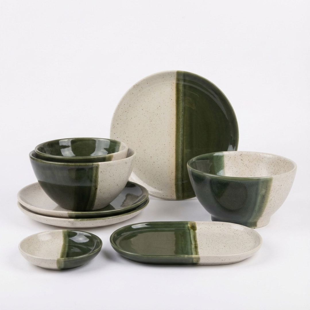 Olive ceramic tableware set with plates and bowls in two-tone green and natural finish.