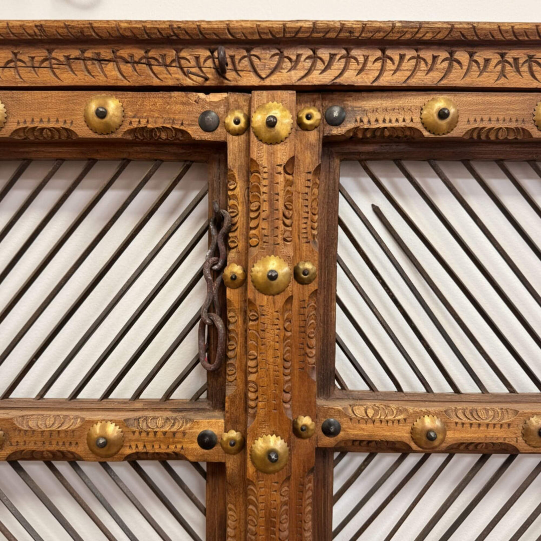 Close-up of the carved wooden details and lattice-style panels.