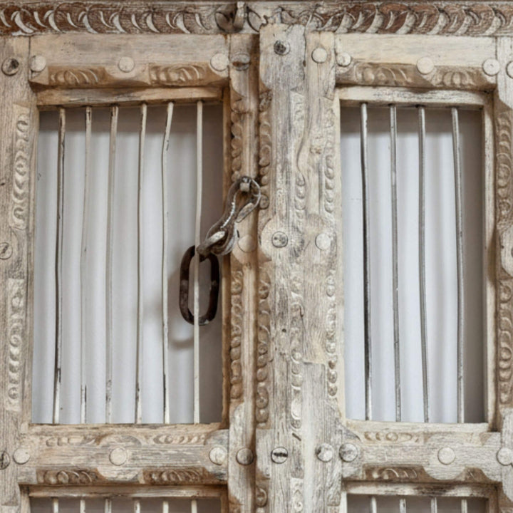 Detail of latch and panel texture on the Olmen Window in sheesham wood.

