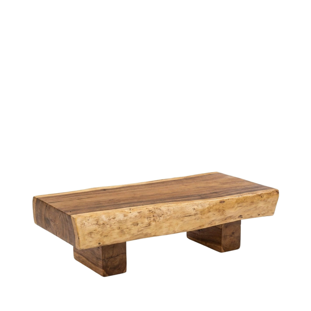 Angled view of the Ombak Mati coffee table showcasing its solid suar wood block design.