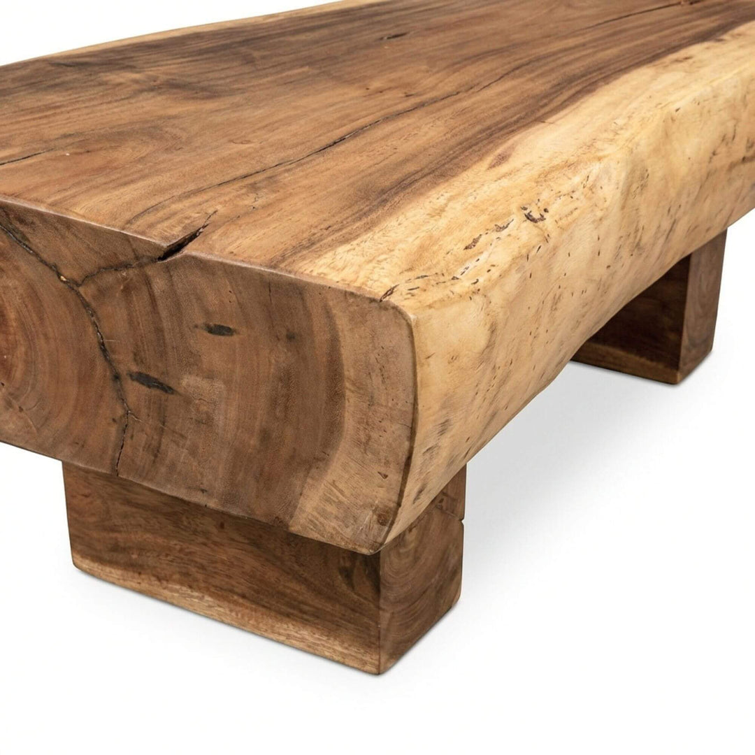 Side view highlighting the thick tabletop and sculptural wooden legs.