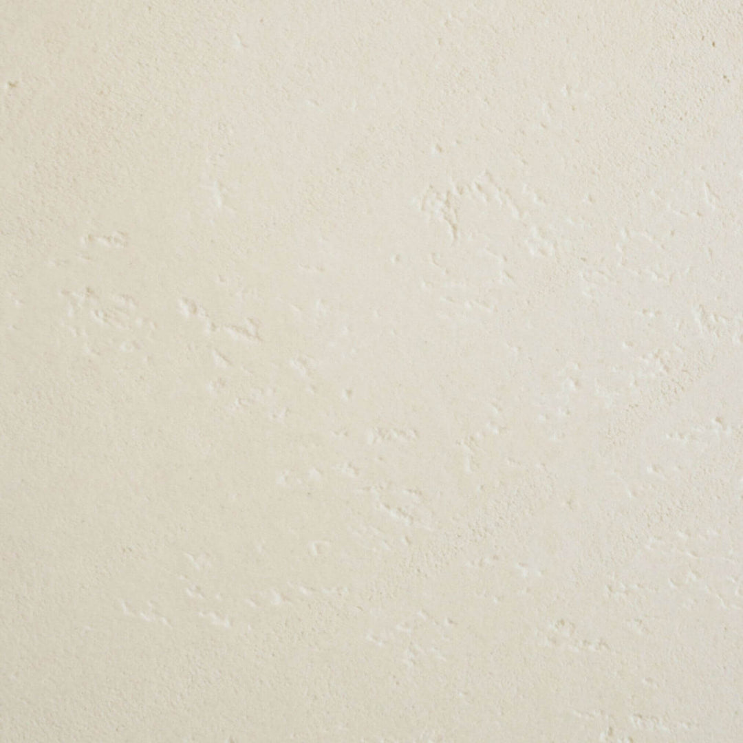 Close-up texture of off-white microcement tabletop