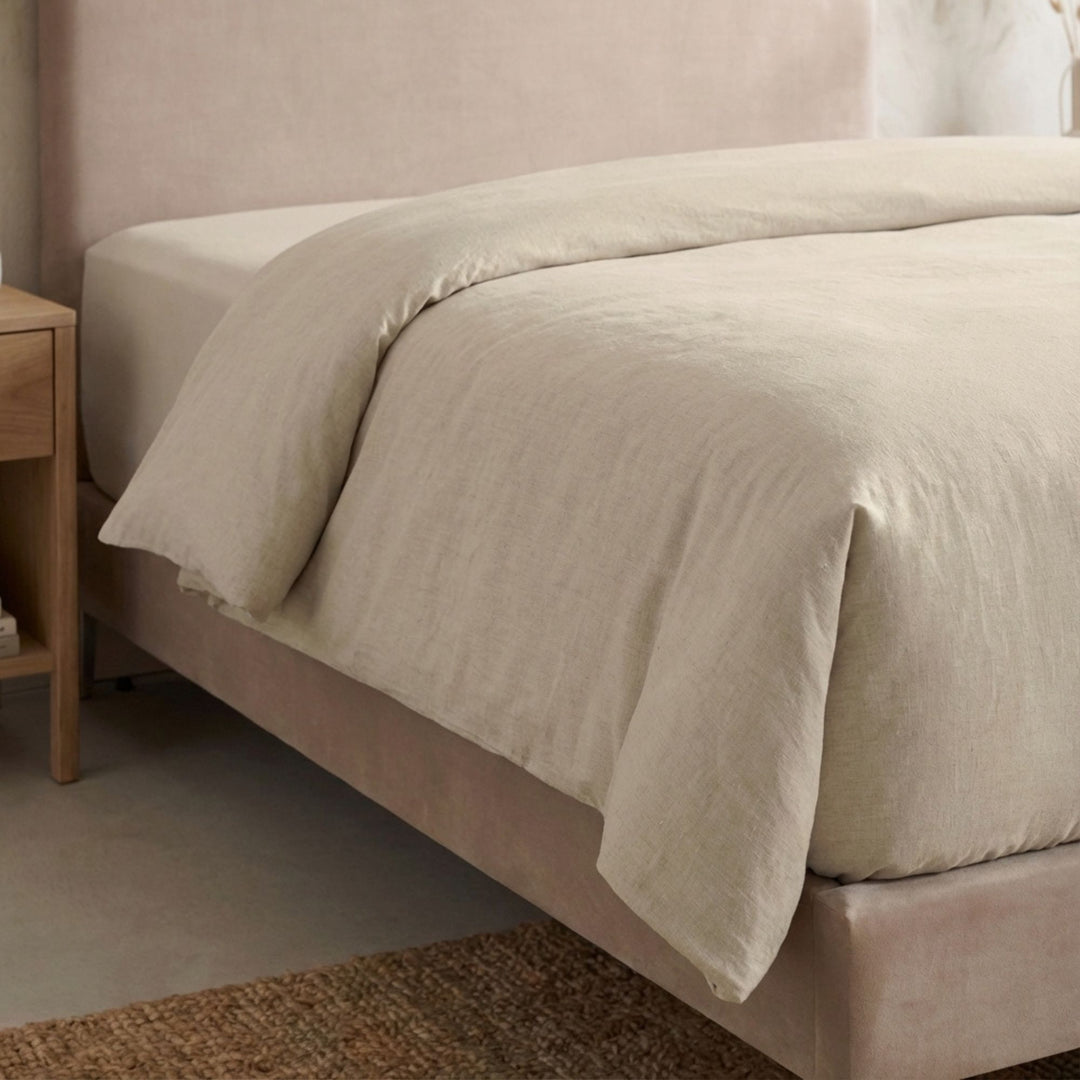 Full view of the Opera duvet cover styled on a bed, showcasing its relaxed cotton-linen texture.