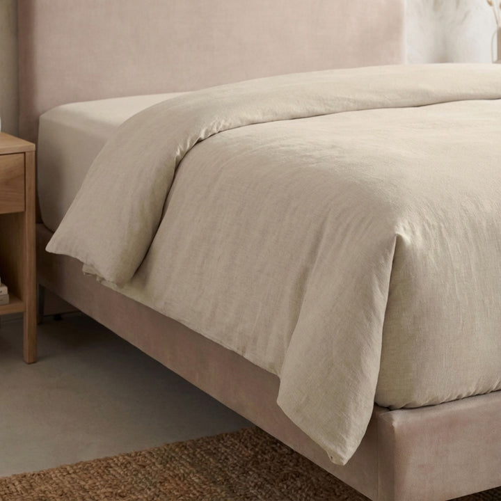 Full view of the Opera duvet cover styled on a bed, showcasing its relaxed cotton-linen texture.