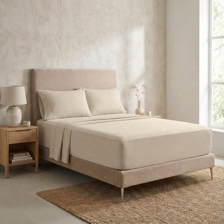 Bedroom setting featuring the Opera top sheet styled in a minimalist, natural interior.
