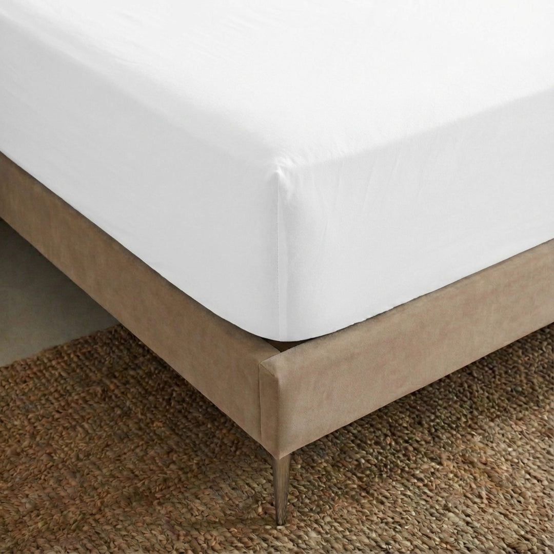 Close-up view of the Opera fitted sheet showing its smooth cotton-linen texture and tailored finish.