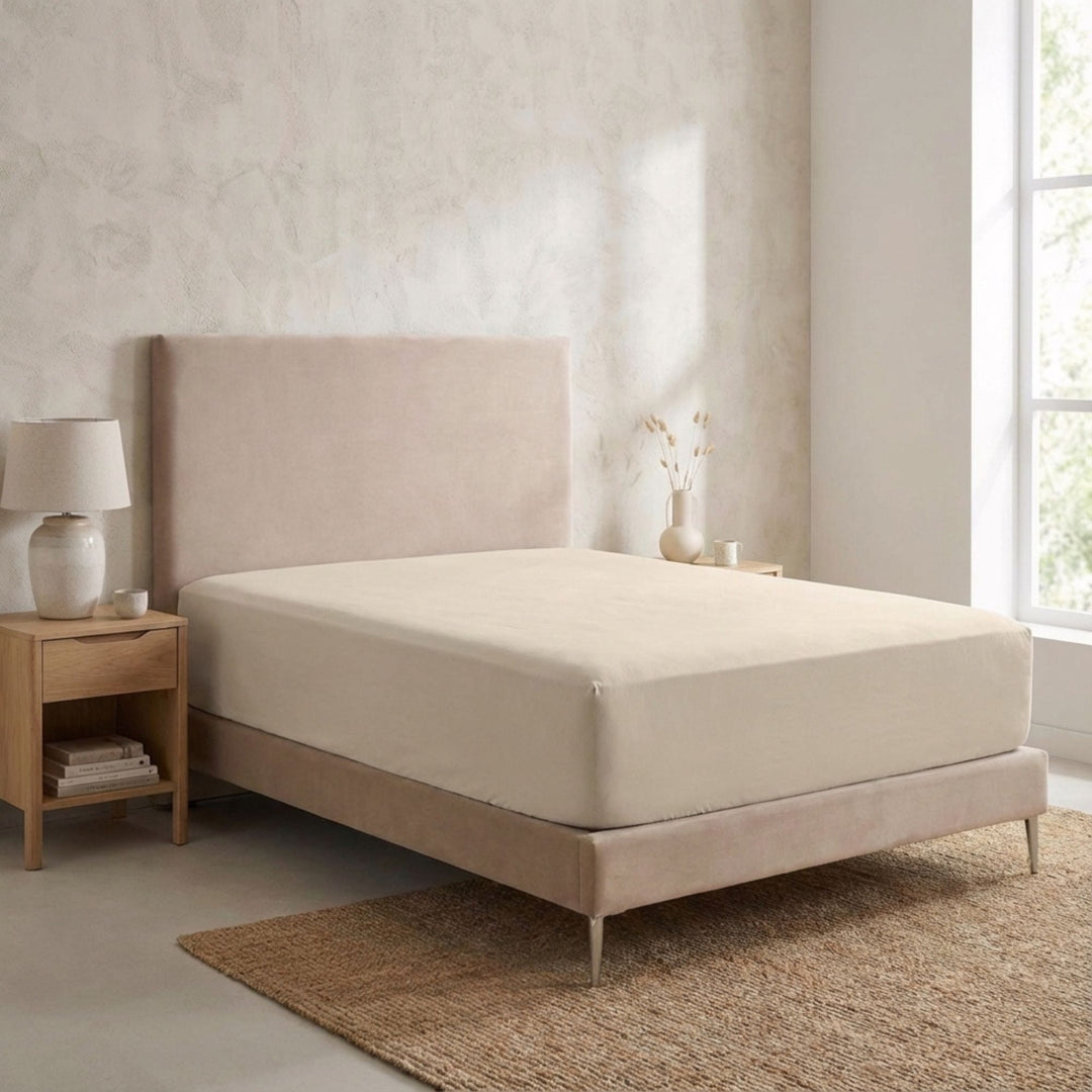 Bedroom setting featuring the Opera fitted sheet fitted neatly over a mattress.