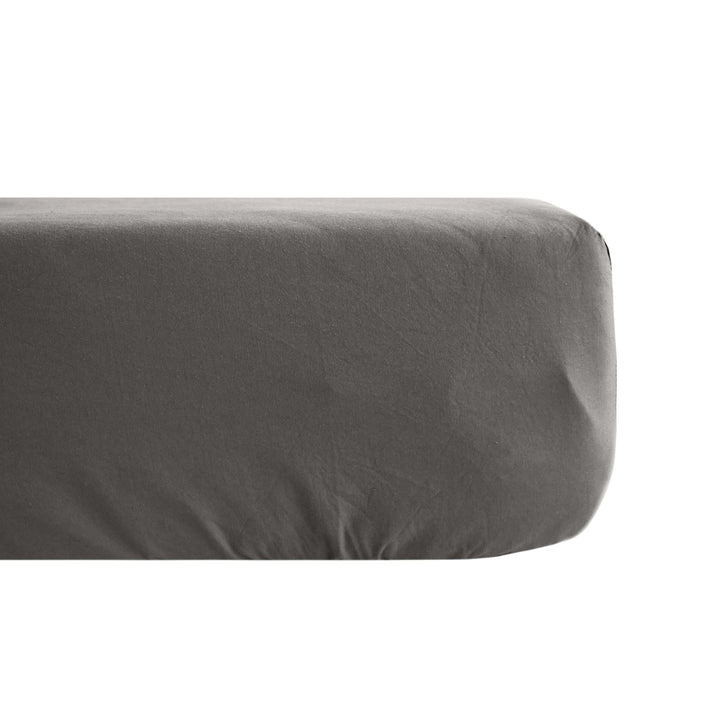 Detail of the Opera fitted sheet highlighting its breathable fabric and natural drape.