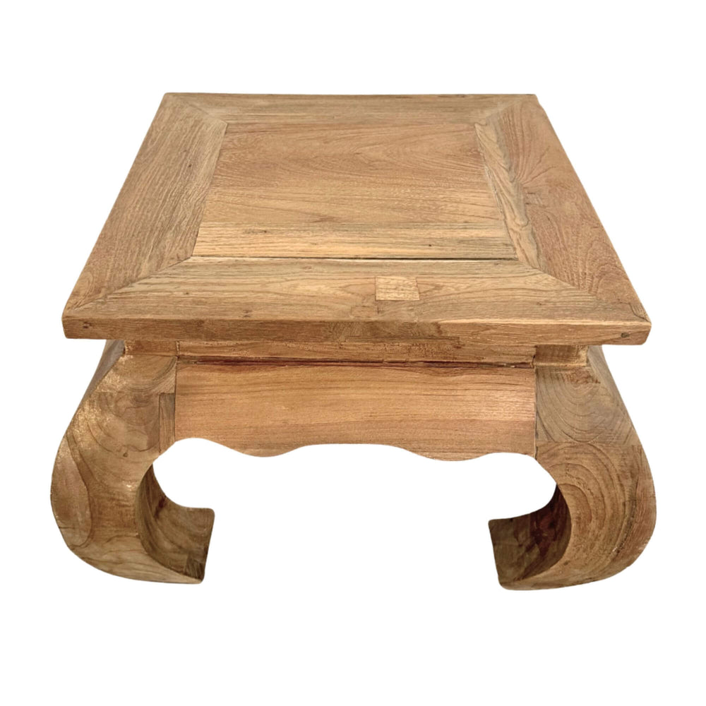 Opium Coffee Table made of natural teak wood with traditional curved legs.
