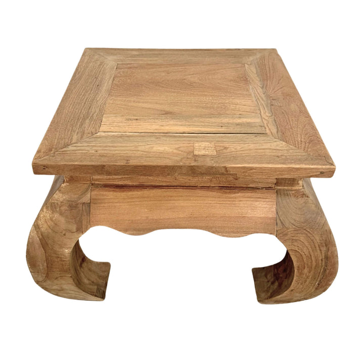 Opium Coffee Table made of natural teak wood with traditional curved legs.