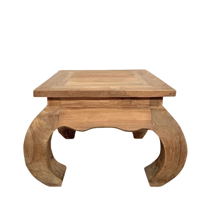 Front view of Opium coffee table highlighting its curved legs and solid teak wood structure.