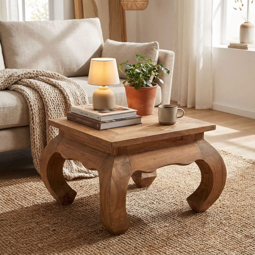 Styled interior scene featuring the Opium coffee table in a warm, natural living room setting.