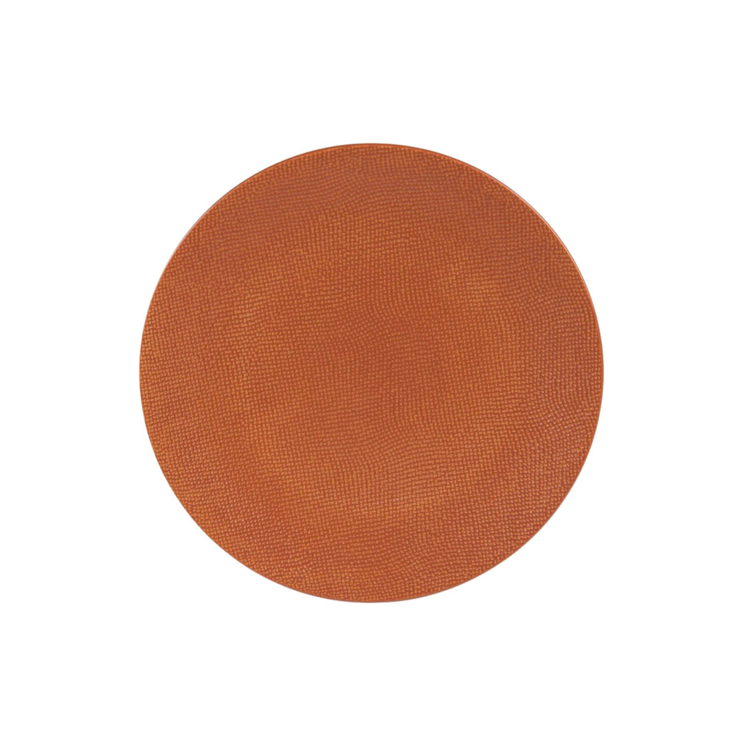 Top view of terracotta orange ceramic dessert plate with textured surface.