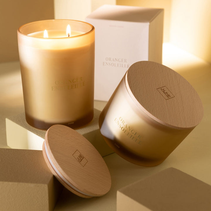 Lifestyle display of the scented candle collection arranged on a shelf.