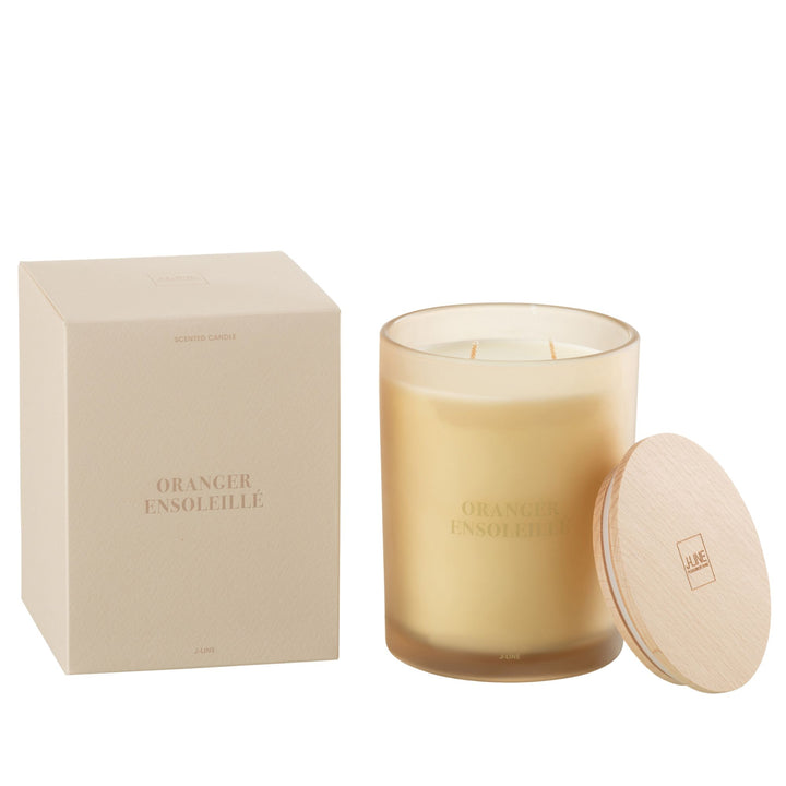 Large-size Oranger Ensoleillé candle with wooden lid beside packaging box.