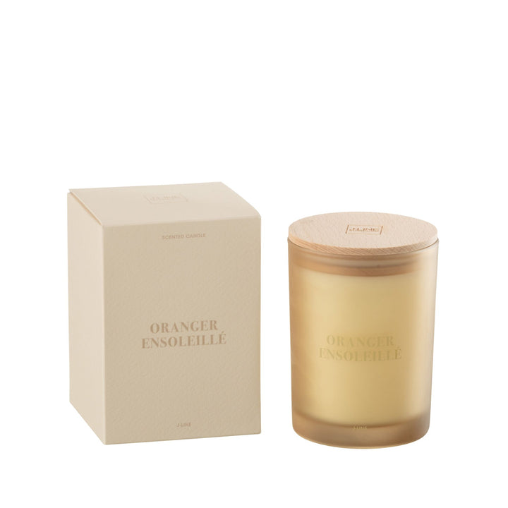 Medium-size Oranger Ensoleillé candle with wooden lid beside packaging box.
