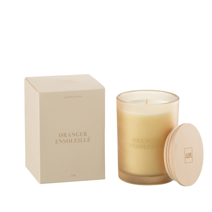 Medium-size Oranger Ensoleillé candle with wooden lid beside packaging box.