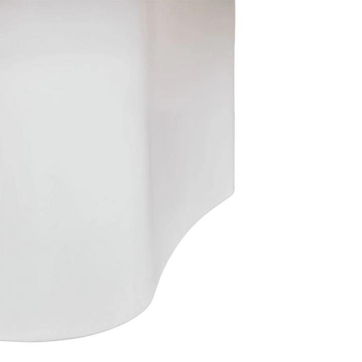 Detail of the curved base showing the soft sculptural transition and mineral texture.