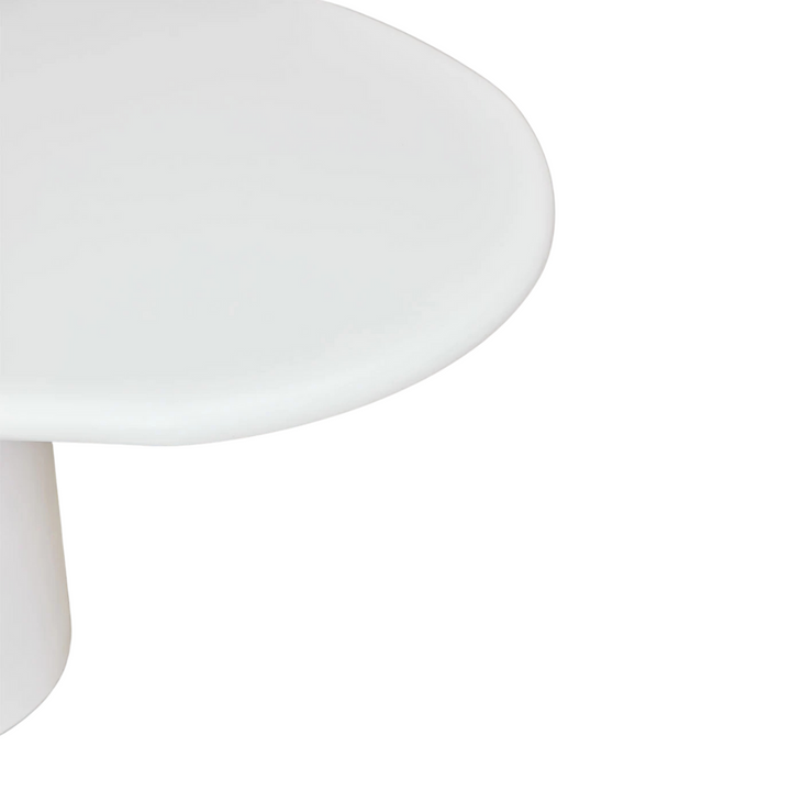 Close-up of the rounded tabletop corner emphasizing the organic shape.