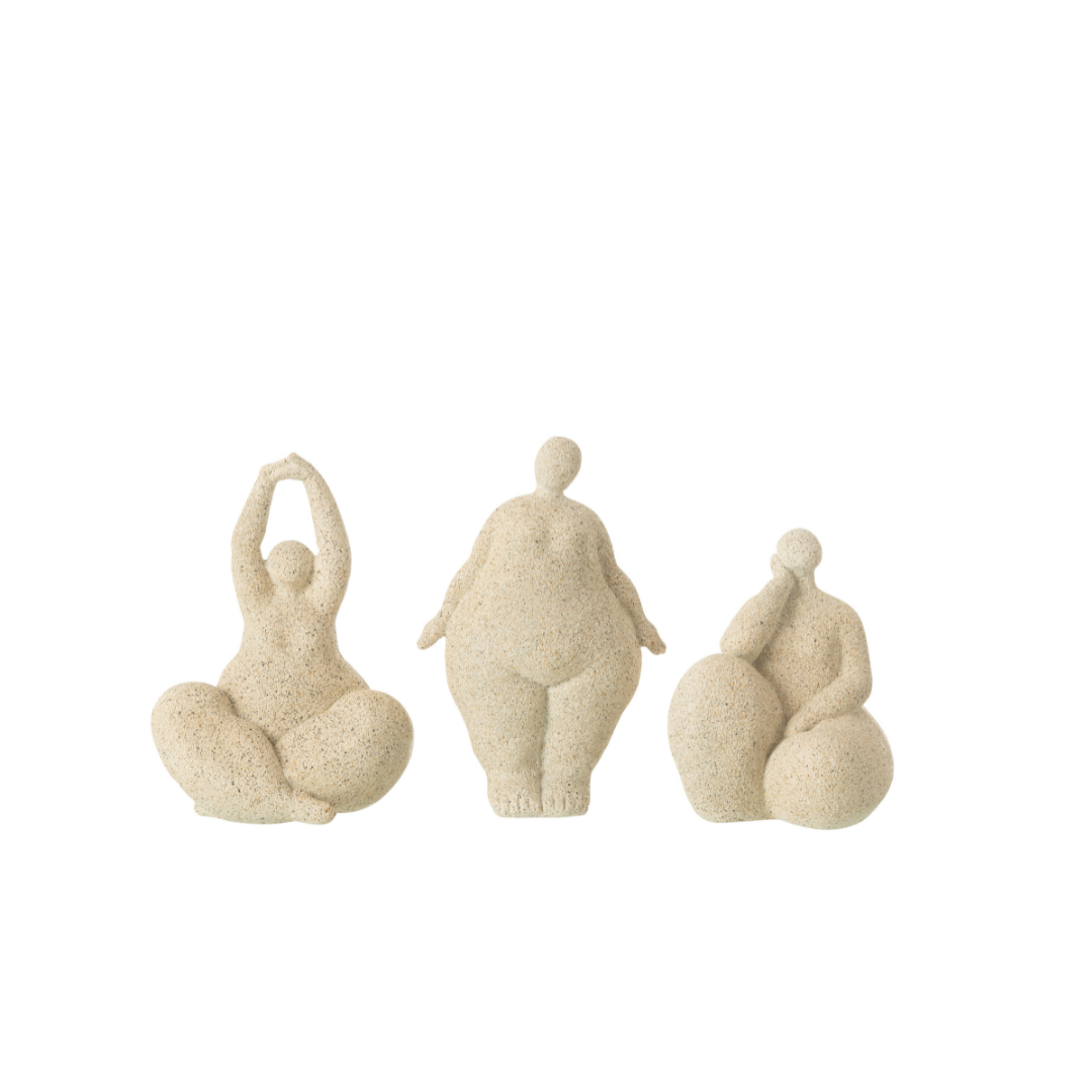 Group of beige organic muse sculptures displayed together as a sculptural set.