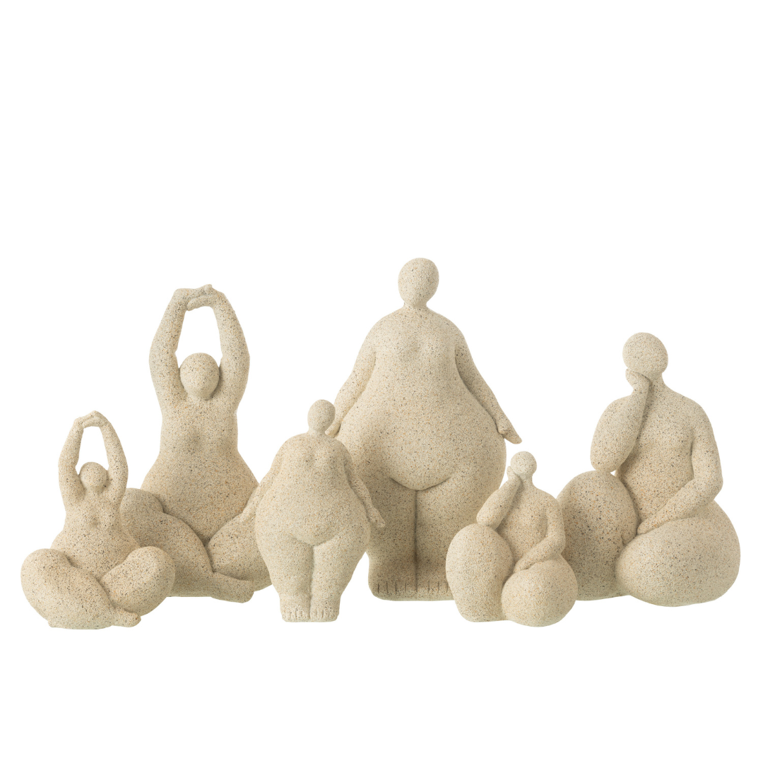 Group of beige organic muse sculptures displayed together as a sculptural set.