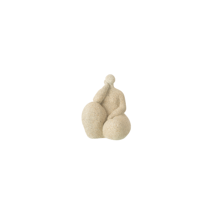 Beige resin figurative sculpture with rounded organic form on white background.