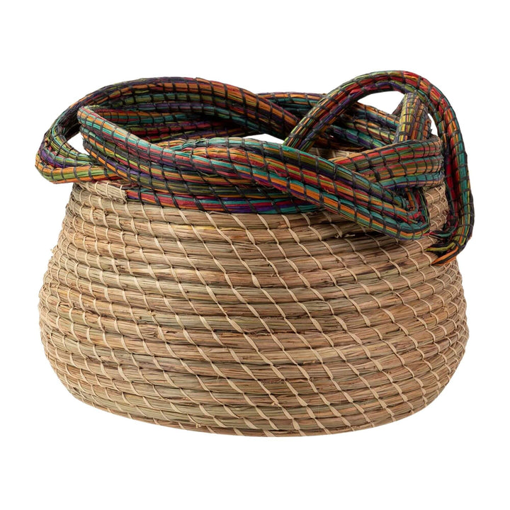 Orisha Basket handwoven from natural seaweed with a colorful rim.
