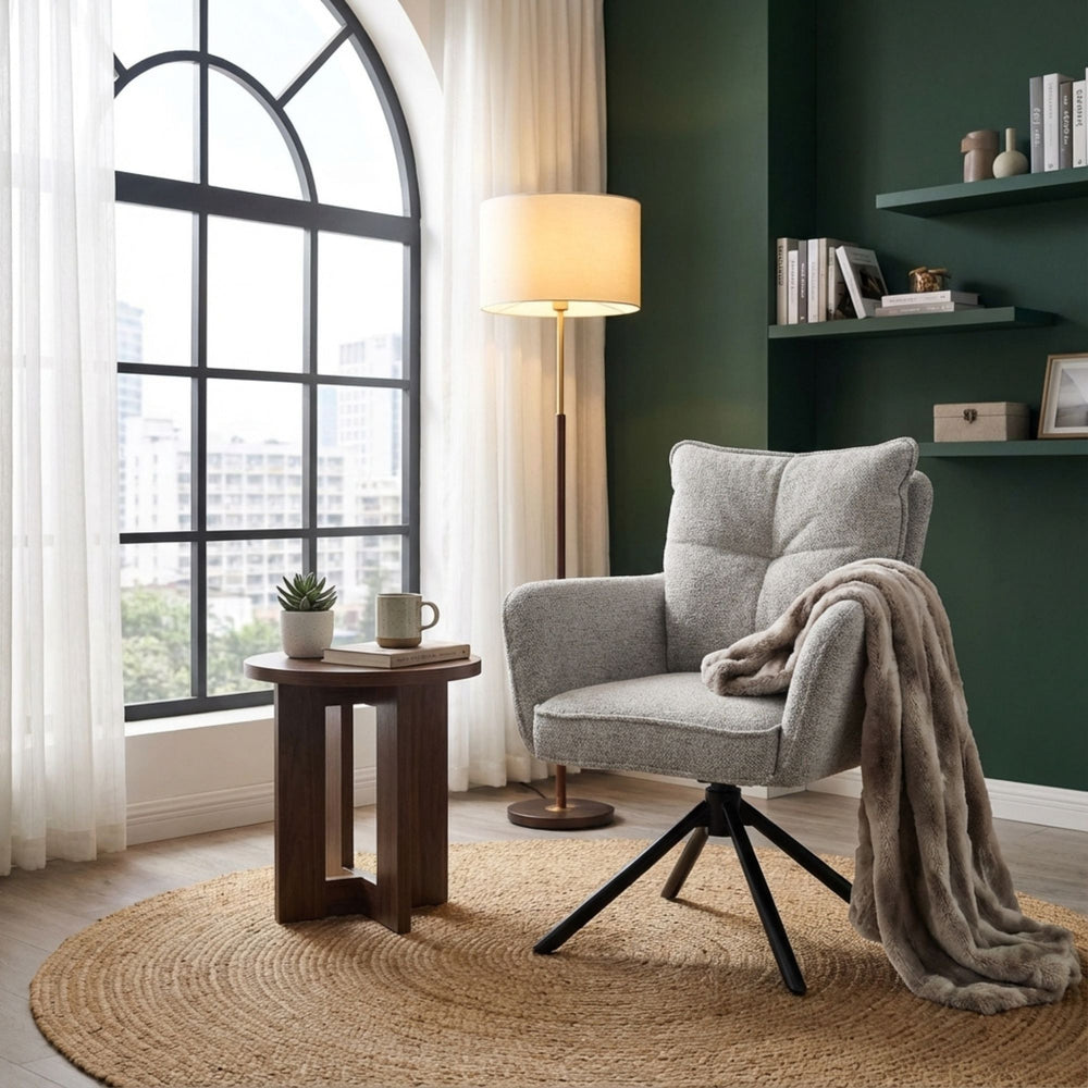 Styled room showing the grey Oslo Dining Chair beside a wooden round table.