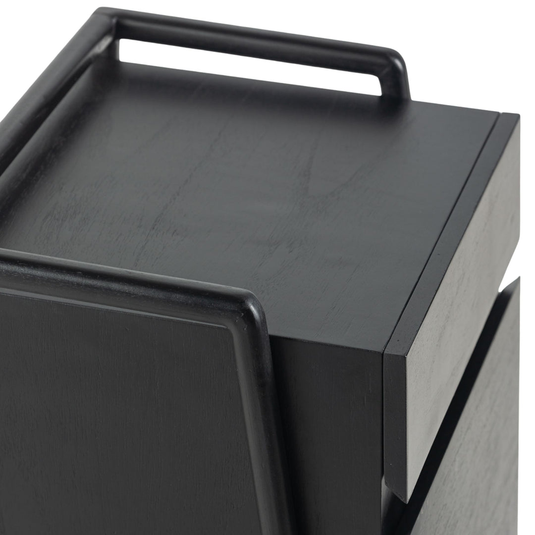 Close-up of the top and handle detail of the Otemanu bedside table in black finish.