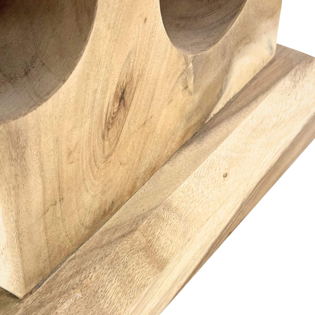 Close-up of Osiris Wine Rack showing carved suar wood grain and curved cradles