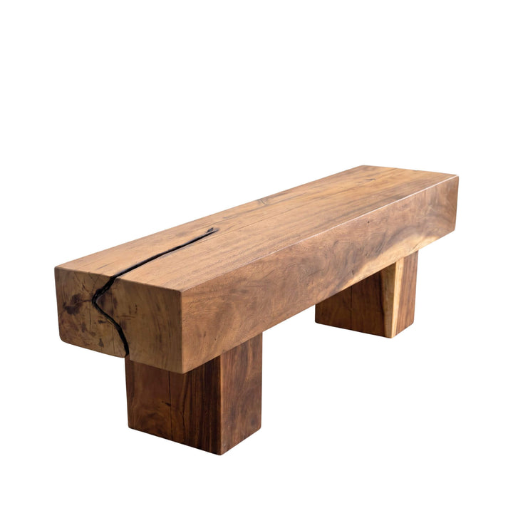 Front angled view of the Palawan coffee table in solid suar wood with a thick rectangular top and block-style legs