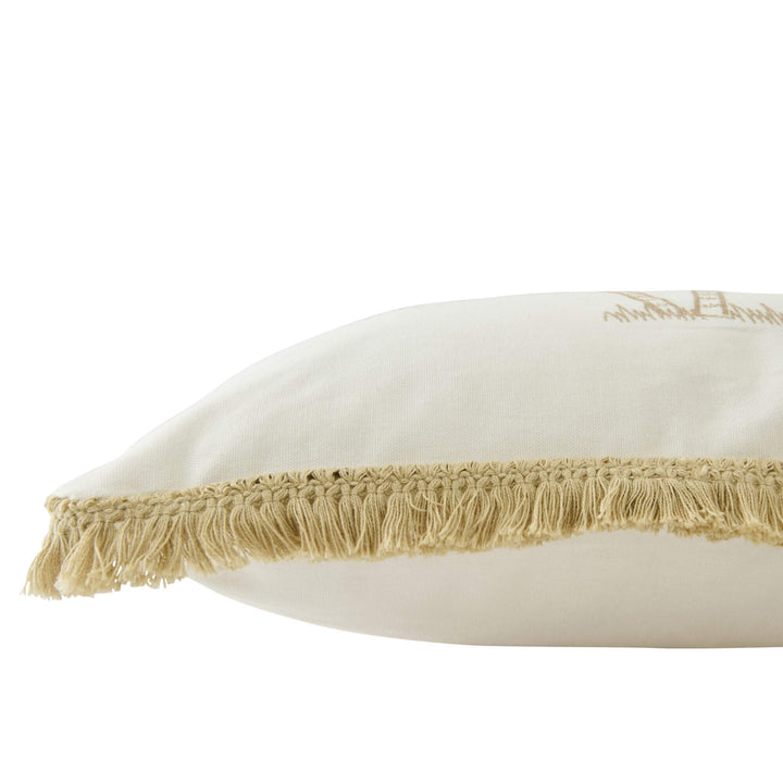Close-up detail of the fringe trim and side profile of the cushion.