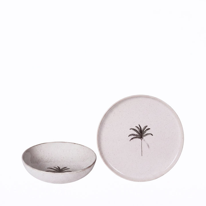 Palm ceramic tableware set featuring an ivory plate and bowl with delicate black palm motifs