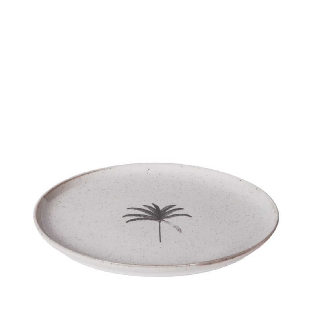 Angled side view of the Palm ceramic plate showing its softly speckled glazed surface